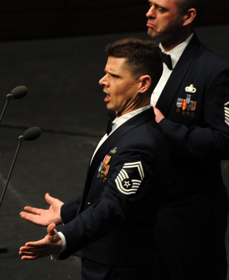 Senior Master Sgt. Robert Harrelson (left) and Master Sgt. Eric Sullivan Jr. perform during a concert featuring the U.S. Air Force Band’s Concert Band and Singing Sergeants at the College of DuPage in Glen Ellyn, Ill, April 4, 2014. Harrelson, a native of Boiling Springs, N.C., is a baritone vocalist. Sullivan, a native of Wilson, N.C., is a baritone vocalist. (U.S. Air Force photo/Master Sgt. Tammie Moore)