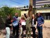 Bobby Rich, Greg Curtis and Mrs. Grant from the MixFM Morning Mix helped base personnel surprise Jeannette Maré, founder and Executive Director of Ben’s Bells, with the news that she has been selected as the recipient of a ‘Hometown Hero’ orientation flight with the U.S. Air Force Thunderbirds.  Maré will fly April 11 as part of pre-Open House activities at the base.  From left to right: Mrs. Grant, Bobby Rich, Jeannette Maré, Open House director Maj. Patrick Smiley, Davis-Monthan Public Affairs representative Nicole Dalrymple, and Greg Curtis. (Photo courtesy of Ben’s Bells)  