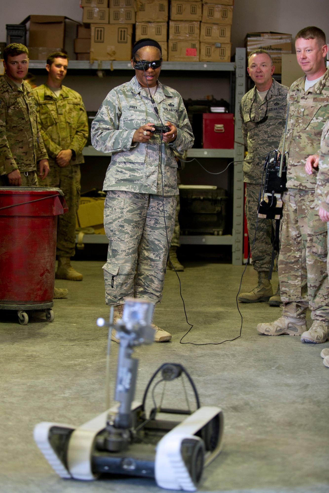 Chief Master Sgt. Shelina Frey, the Air Forces Central Command Chief, operates a robot used by explosive ordinance technicans to investigate potential explosive devices.  Frey visited the 386th Expeditionary Civil Engineer Squadron's EOD section on April 5, 2014 to meet with the Airmen and find out more about their mission.  (U.S. Air Force photo by Senior Master Sgt. Burke Baker)
