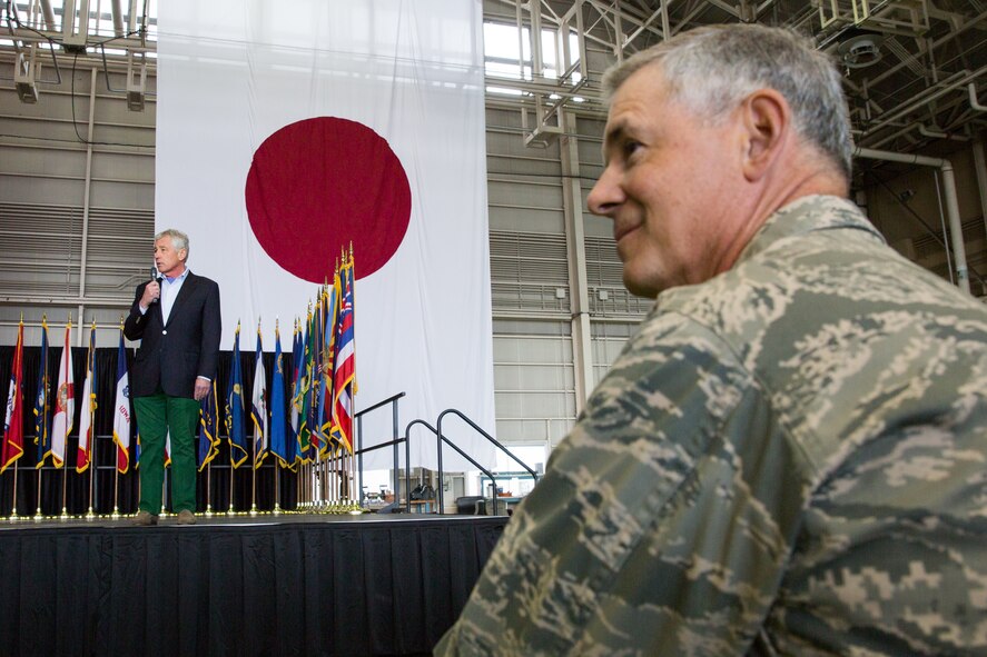 Lt. Gen. Sam Angelella, U.S. Forces Japan and 5th Air Force commander, listens as U.S. Secretary of Defense Chuck Hagel addresses a bilateral audience of U.S. and Japanese service members at Yokota Air Base, Japan, April 5, 2014.  Hagel visited Yokota during his fourth official visit to the Asia-Pacific region, which includes stops in Hawaii, Japan, China and Mongolia. (U.S. Air Force photo by Osakabe Yasuo/Released)