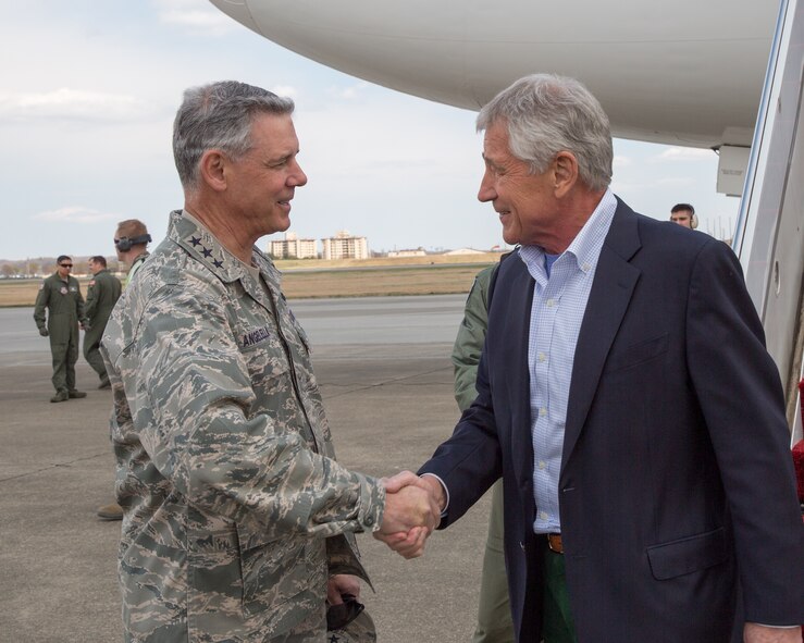 Lt. Gen. Sam Angelella, U.S. Forces Japan and 5th Air Force commander, greets U.S. Secretary of Defense Chuck Hagel upon his arrival at Yokota Air Base, Japan, April 5, 2014.  Hagel visited Yokota during his fourth official visit to the Asia-Pacific region, which includes stops in Hawaii, Japan, China and Mongolia. (U.S. Air Force photo by Osakabe Yasuo/Released)