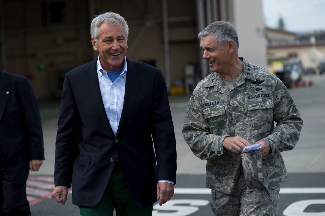 U.S. Defense Secretary Chuck Hagel walks with U.S. Air Force Lt. Gen. Salvatore A. “Sam” Angelella, commander of U.S. Forces Japan, after speaking with U.S. and Japanese troops on Yakota Air Force Base, Japan April 5, 2014.