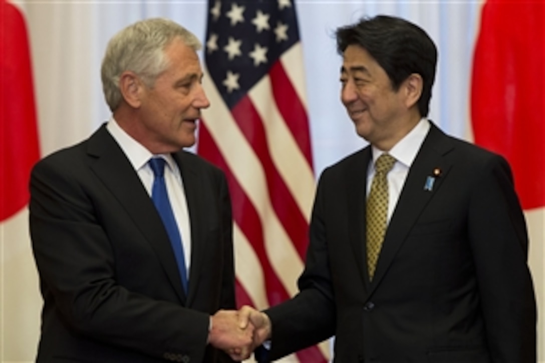 U.S. Defense Secretary Chuck Hagel and Japanese Prime Minister Shinzo Abe shake hands during a meeting at Sori Daijin Kantei, the prime minister's official residence, in Tokyo, April 5, 2014. Hagel and Abe met to discuss issues of mutual importance.