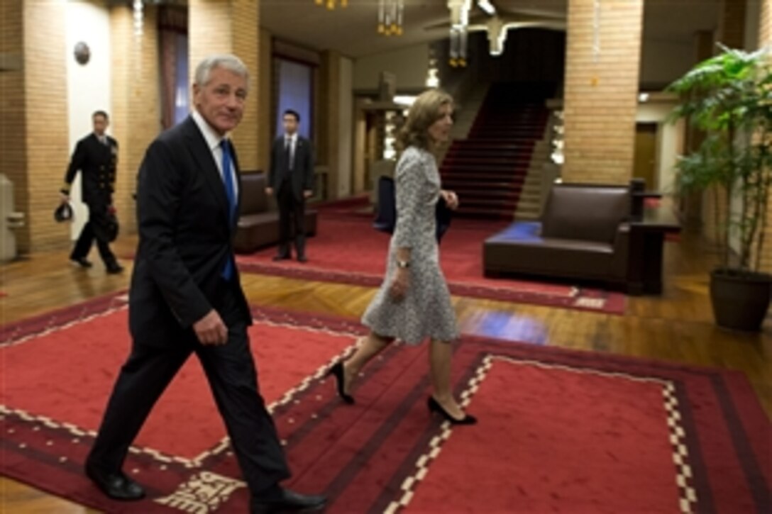 U.S. Defense Secretary Chuck Hagel and U.S. Ambassador to Japan Caroline Kennedy walk together after meeting with Japanese Prime Minister Shinzo Abe at Sori Daijin Kantei, the prime minister's official residence, in Tokyo, April 5, 2014. Hagel and Abe met to discuss issues of mutual importance.
