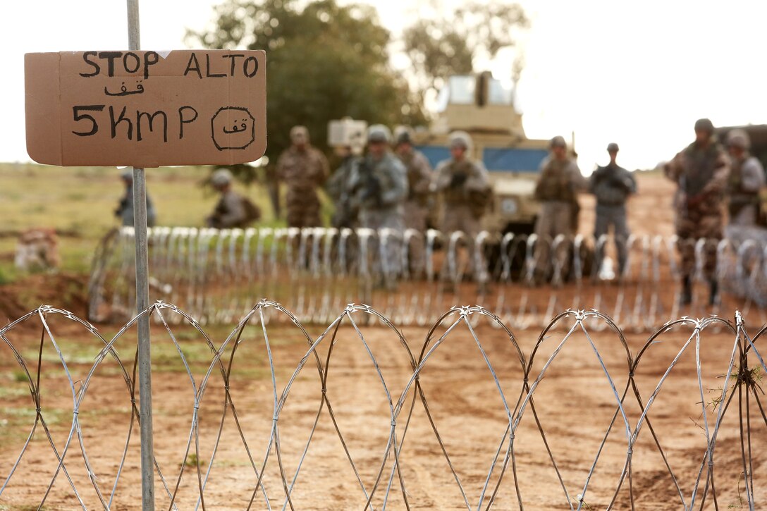 Moroccan soldiers, U.S. Marines with 2nd Law Enforcement Battalion, 2nd Marine Expeditionary Brigade, II Marine Expeditionary Force,  along with Air Force and Army Augments prepare for a suspicious vehicle at a simulated entry control point during a capabilities demonstration for distinguished visitors during African Lion 2014 in the Tifnit training ara of Morocco Apr 4, 2014.

Exercise African Lion 14 is a multi-lateral and combined-joint exercise between the Kingdom of Morocco, the U.S. and other partner nations designed to strengthen relationships with participating countries by increasing understanding of each nation's military capabilities.  The military-to-military portion of the exercise includes: command-post exercises with humanitarian aid and disaster relief themes; stability operations, such as nonlethal weapons training and respond-to-crisis drills; and an intelligence capability-building workshop.