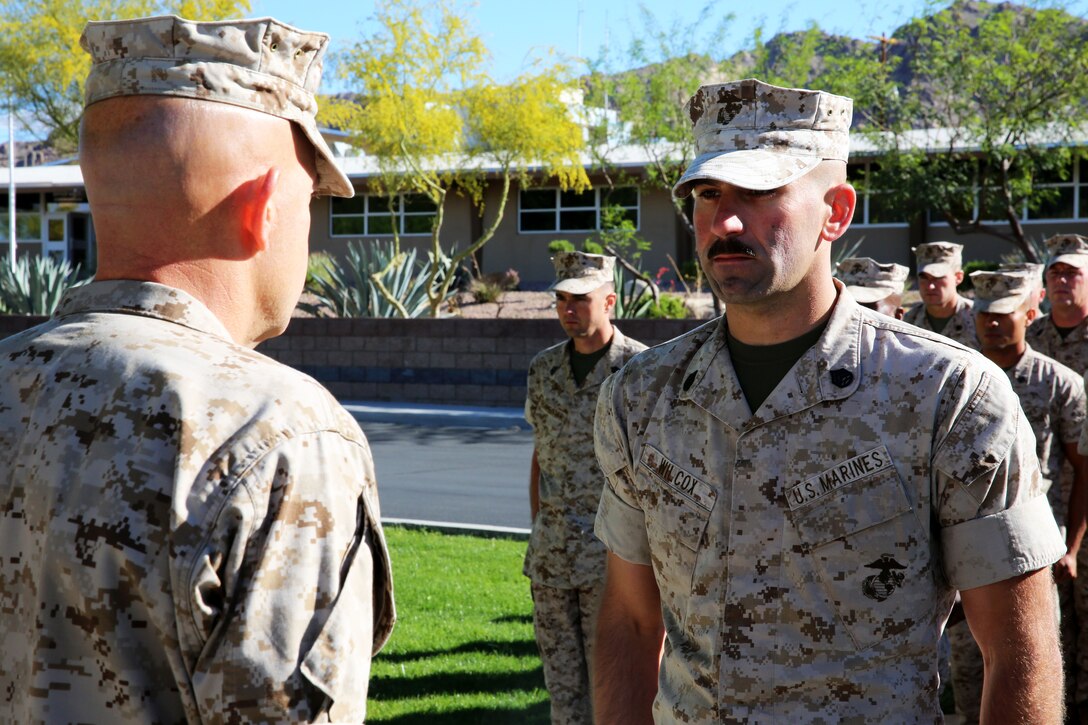 Gunnery Sgt. Craig Wilcox, Company A gunnery sergeant, Headquarters Battalion, reports to Maj. Gen. David H. Berger, Combat Center Commanding General, during his meritorious promotion to gunnery sergeant at Lance Cpl. Torrey L. Gray Field, April 2, 2014. Wilcox recently won a meritorious gunnery sergeant board.
(Official Marine Corps Photo By Lance Cpl. Kasey Peacock/Released)


