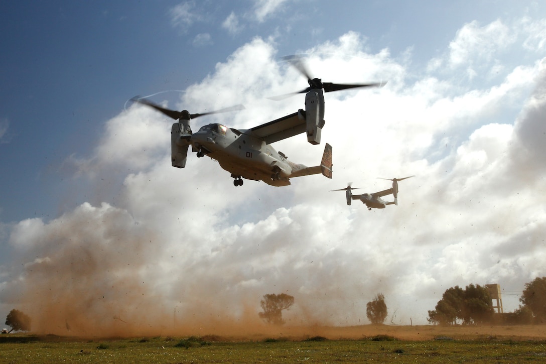 Two Marine Corps V-22 Ospreys approach the landing zone in Tifnit, Morocco during a capabilities demonstration for distinguished visitors and participating multinational observers April 4, 2014 during Exercise African Lion 14. Exercise African Lion 14 is a multi-lateral and combined-joint exercise between the Kingdom of Morocco, the U.S. and other partner nations designed to strengthen relationships with participating countries by increasing understanding of each nation's military capabilities. The military-to-military portion of the exercise includes: command-post exercises with humanitarian aid and disaster relief themes; stability operations, such as nonlethal weapons training and respond-to-crisis drills; and an intelligence capability-building workshop.