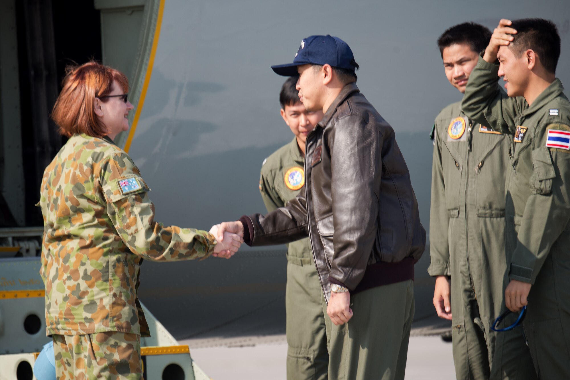 (Left to right) Royal Australia Air Force Group Capt. Barbara Courtney, United Nations Command (Rear) commander greets Royal Thai Air Force Flight Lieutenant Promrob Chanchom at Yokota Air Base, Japan, April 1, 2014. Members of the Royal Thai Air Force visited Yokota for an annual mission of the UNC-R, a tenant unit at Yokota. (U.S. Air Force photo by Osakabe Yasuo/Released)