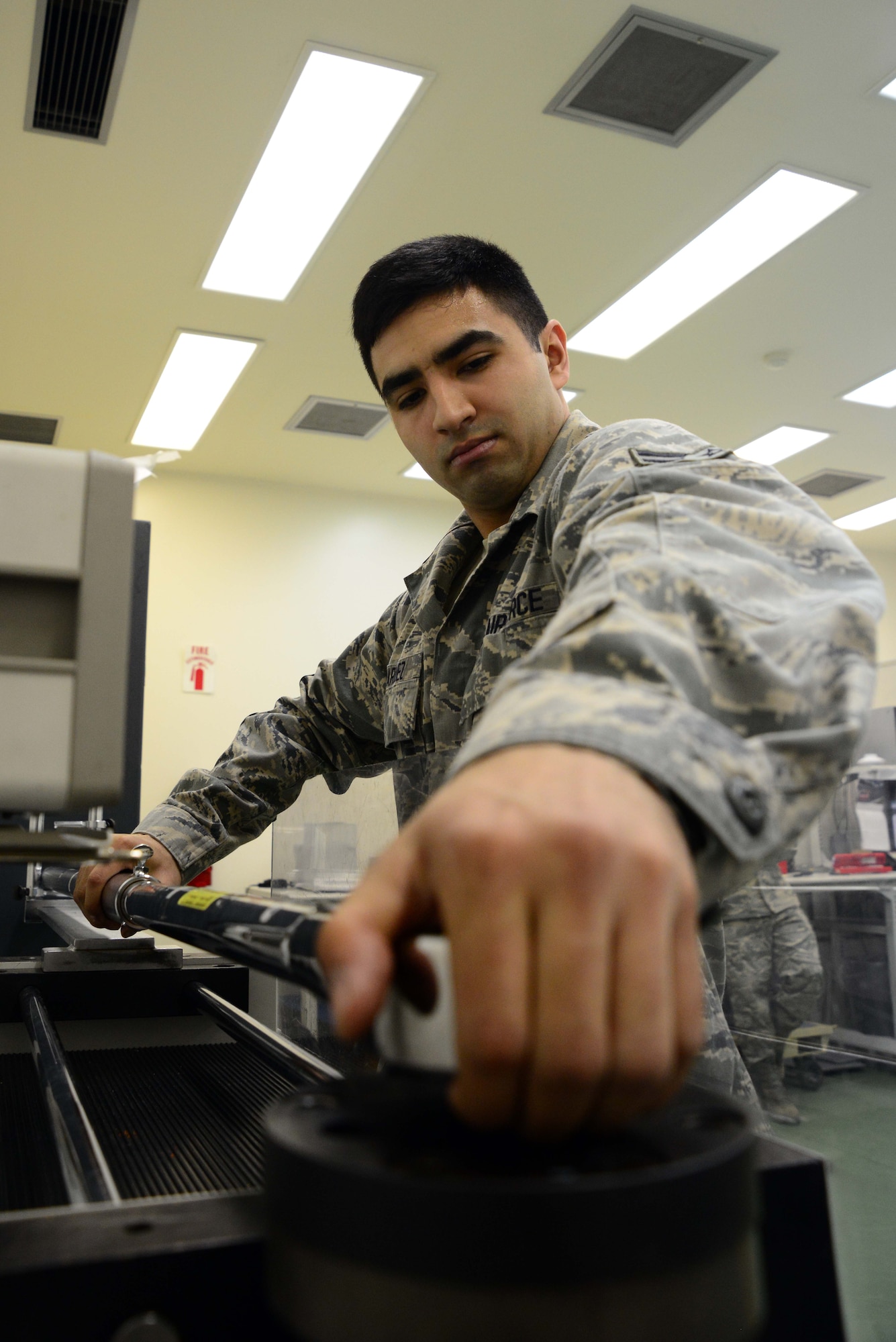 U.S. Air Force Airman 1st Class Juan Marquez, 35th Maintenance Squadron, calibrates a torque wrench used on F-16 Fighting Falcons at Misawa Air Base, Japan, March 28, 2014. Marquez works in the Precision Measurement Equipment Laboratory, where they calibrate every torque wrench used by the nearly 1,000 maintainers across base. (U.S. Air Force photo/Senior Airman Derek VanHorn)