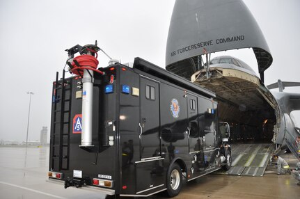 "The Sentinel", a command, communications and control vehicle from Joint Base San Antonio-Ft. Sam Houston’s Army North’s Task Force-51 drives onto a C-5A Galaxy on April 6, 2014. Air Force Reservists and active duty Soldiers trained to load and offload Task Force-51’s vehicles onto a C-5A Galaxy.  (U.S. Air Force photo by Tech Sgt. Carlos J. Trevino)