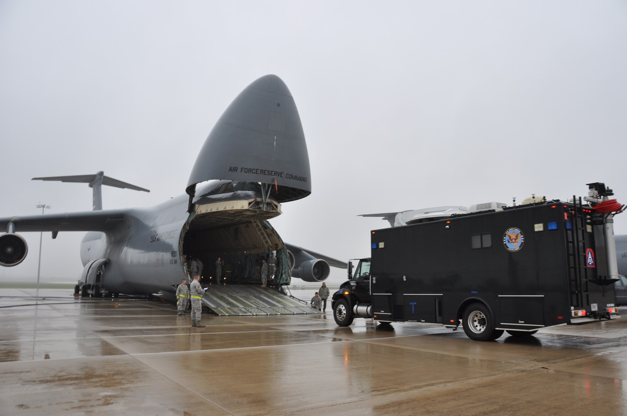 "The Sentinel", a command, communications and control vehicle from Joint Base San Antonio-Ft. Sam Houston’s Army North’s Task Force-51 drives onto a C-5A Galaxy aircraft, April 6, 2014 at Joint Base San Antonio-Lackland, Texas. Air Force Reservists and active-duty Soldiers trained to load and off-load Task Force-51’s vehicles onto a C-5A Galaxy.  (U.S. Air Force photo by Tech Sgt. Carlos J. Trevino)