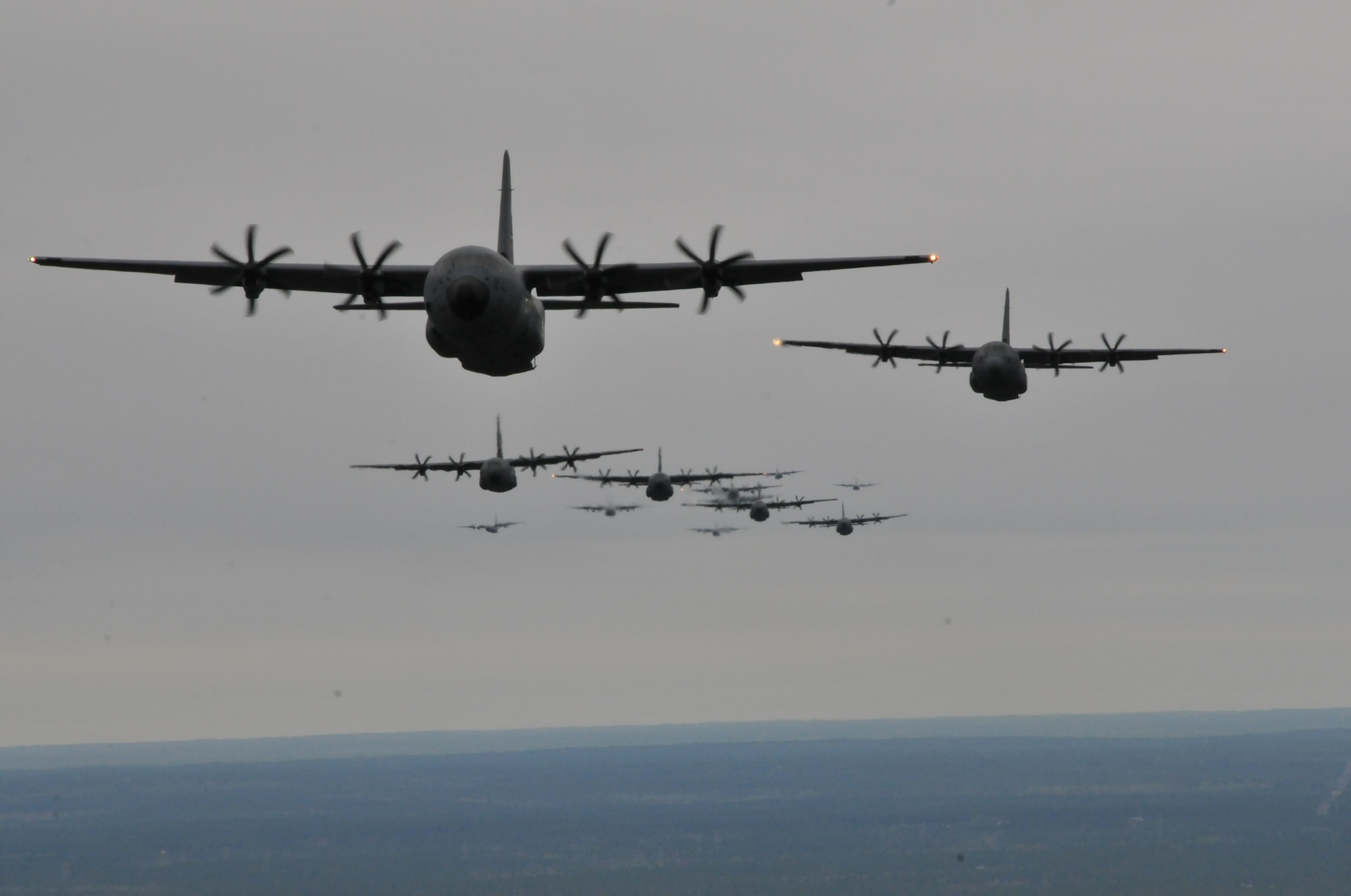 The 403rd Wing's C-130J and WC-130J aircraft fly in formation during a Operation Surge Capacity here April, 5, 2014.  Aircraft from the 815th and 345th Airlift Squadrons and 53rd Weather Reconnaissance Squadron participated in Operation Surge Capacity, a large scale training exercise designed to test the 403rd Wing's ability to launch and recover a large formation of aircraft and to execute airdrops. (U.S. Air Force photo/Senior Airman Nicholas Monteleone)
