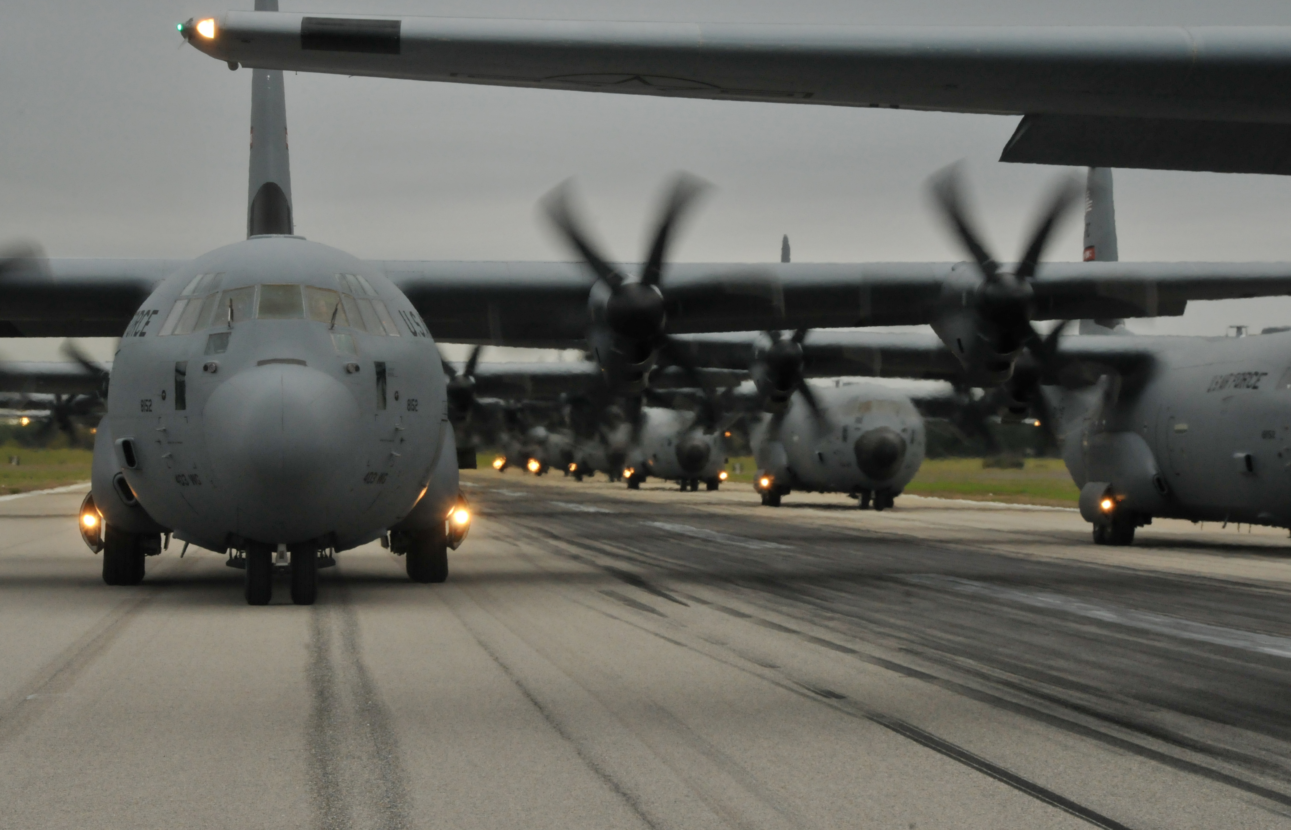 C-130J aircraft from the 815th and 345th Airlift Squadrons and WC-130J aircraft from the 53rd Weather Reconnaissance Squadron taxi on the runway prior to takeoff during Operation Surge Capacity here April, 5, 2014.  Sixteen aircraft from the 403rd Wing participated in Operation Surge Capacity, a large scale training exercise designed to test the multiple capabilities of the wing. (U.S. Air Force photo/Senior Airman Nicholas Monteleone)