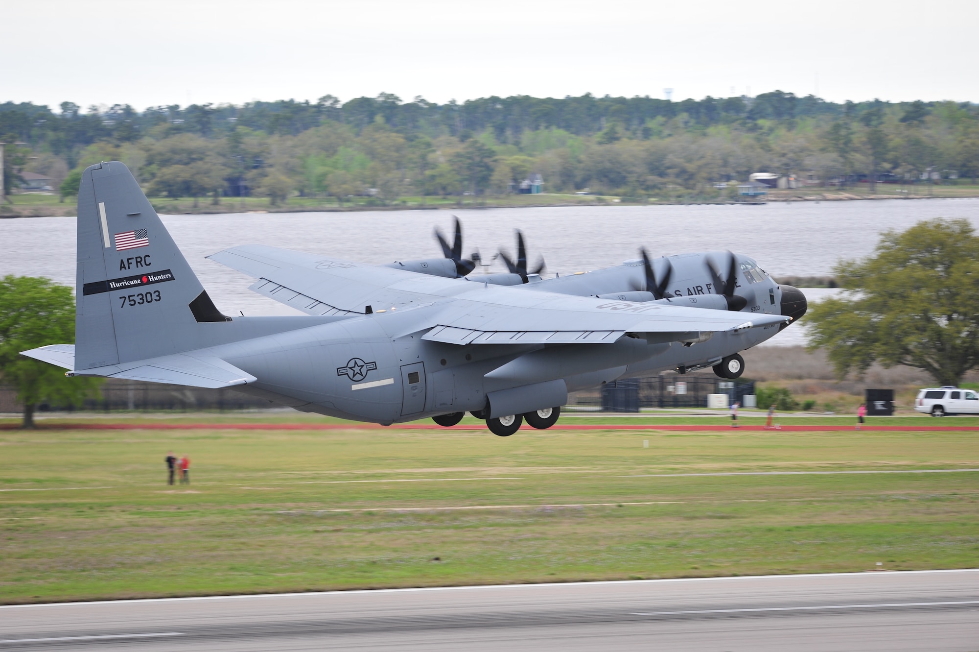 A WC-130J from the 53rd Weather Reconnaissance Squadron takes off in support of Operation Surge Capacity here April 5, 2014.  Sixteen aircraft from the 403rd Wing took part in Operation Surge Capacity, a large scale training exercise designed to test the 403rd Wing's ability to launch and recover a large formation of aircraft and to execute airdrops. (U.S. Air Force photo/Tech. Sgt. Ryan Labadens)