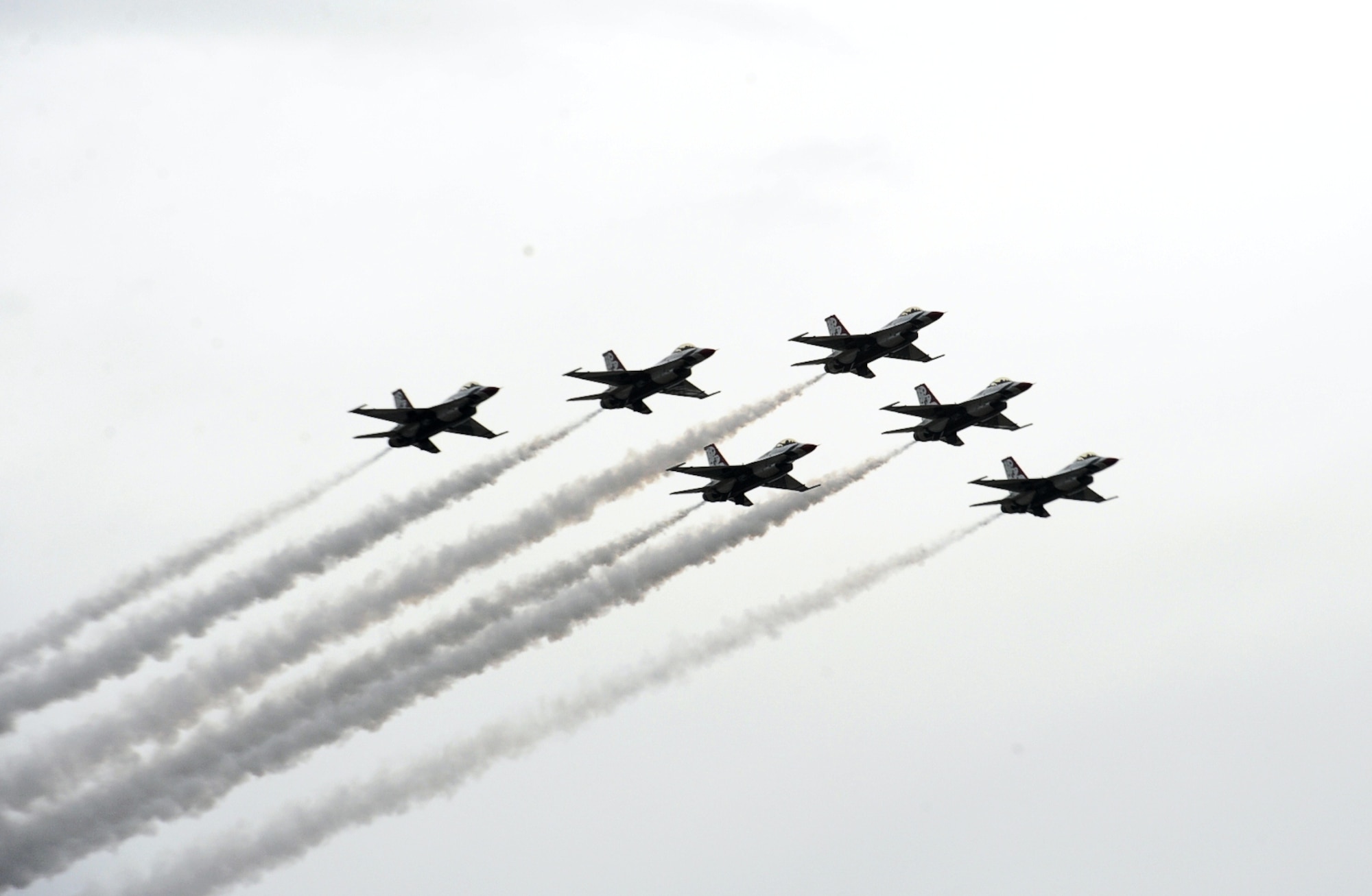 The U.S. Air Force Thunderbirds perform aerial acts during the Wings Over Columbus 2014 Open House and Airshow at Columbus Air Force Base, Miss., April 6, 2014. Although the open house was cut short due to bad weather, all aerial performers completed their acts. (U.S. Air Force Photo/Senior Airman Kaleb Snay)