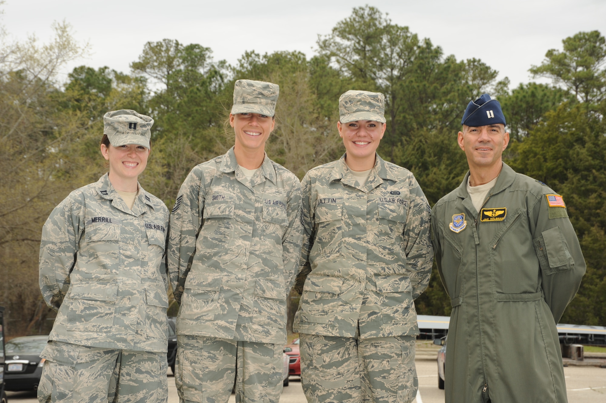 From left to right, Capt. Courtney Merril, an intelligence officer with the 440th Operations Support Squadron (OSS), Tech. Sgt. Mary Smith, non-commissioned-officer-in-charge of the 440th OSS intelligence squadron , Senior Airman Kristany Lattin, a 440th OSS intelligence analyst, and Capt. Jack Solghan, a flight nurse with the 43rd aeromedical evacuation squadron, pose for a group photo at Pope Field, N.C., on Apr. 6, 2014.  Merril, Smith, Lattin and Solghan provided immediate life-saving care to a woman in distress at Pope Filed on Mar. 14, 2014.  According to Solghan, the Airmen used skills acquired in the Air Force to assess the situation and care for the patient until an ambulance arrived shortly after calling emergency services.  (U.S. photo by Tech. Sgt. Peter R. Miller)