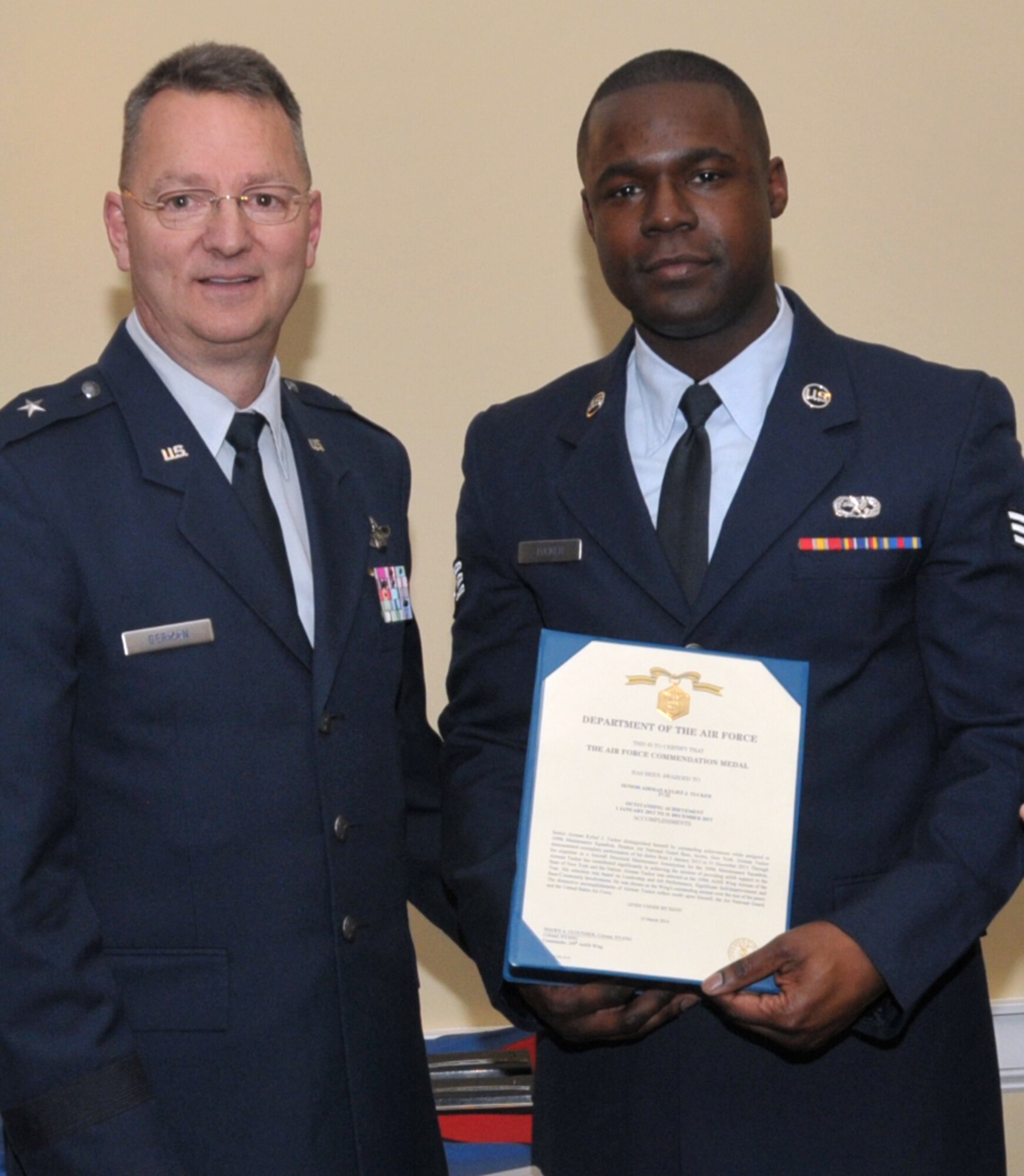 SCOTIA, N.Y. -- Tech. Sgt. Kylief Tucker, right, was named the 109th Airlift Wing's Airman of the Year. He was honored during the annual Airman of the Year Dinner on April 5. Also pictured is Brig. Gen. Anthony German, New York's Chief of Staff-Air. Tucker is assigned to the 109th Maintenance Squadron. (Air National Guard photo by Master Sgt. William Gizara)