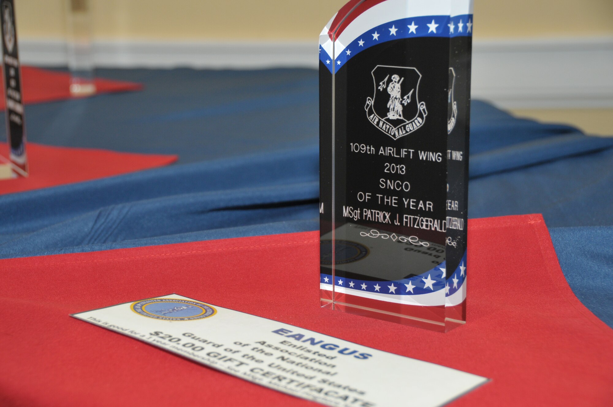 SCOTIA, N.Y. -- Senior Airman Kylief Tucker, Tech. Sgt. Robert Harrington, Master Sgt. Amanda Blodgett, and Senior Master Sgt. Patrick FitzGerald were all honored during the 109th Airlift Wing's annual Airmen of the Year Dinner on April 4.  (Air National Guard photo by Master Sgt. William Gizara/Released)