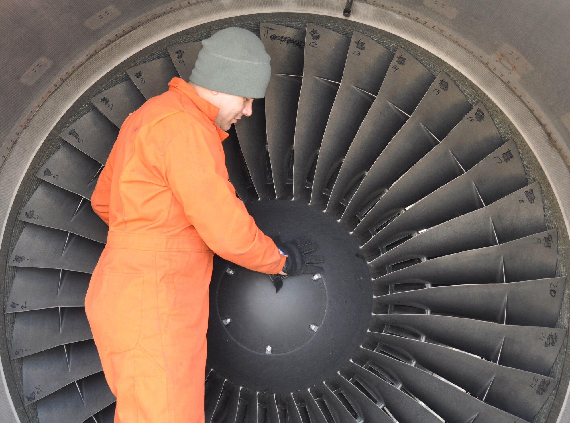 Staff Sgt. Hector Martinez, 514th Aircraft Maintenance Squadron aerospace propulsion technician, conducts a routine inspection of the engine blades of a C-17 Globemaster III aircraft here April 5 (U.S. Air Force photo/Senior Airman Chelsea Smith).