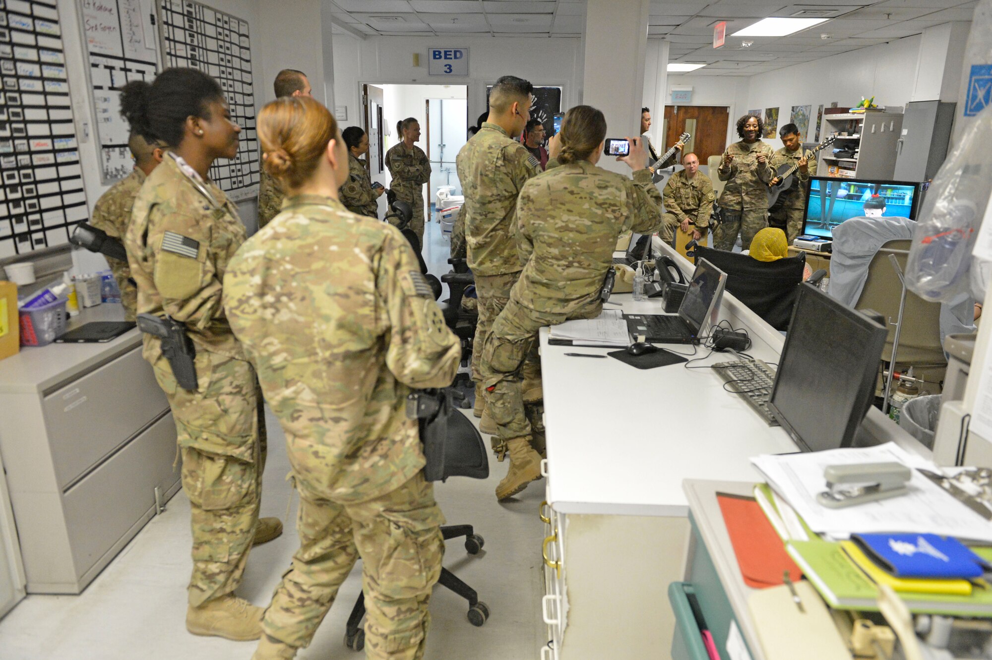 The U.S. Air Force Central Command Band, Hyper Sonic, plays for patients and Service members at Craig Joint Theater Hospital, Bagram Airfield, Afghanistan, March 31, 2014. The band tailored their set to the audience and venue, allowing the flexibility to provide entertainment for those normally unable to attend their performances .(U.S. Air Force photo by Senior Master Sgt. Gary J. Rihn/Released)