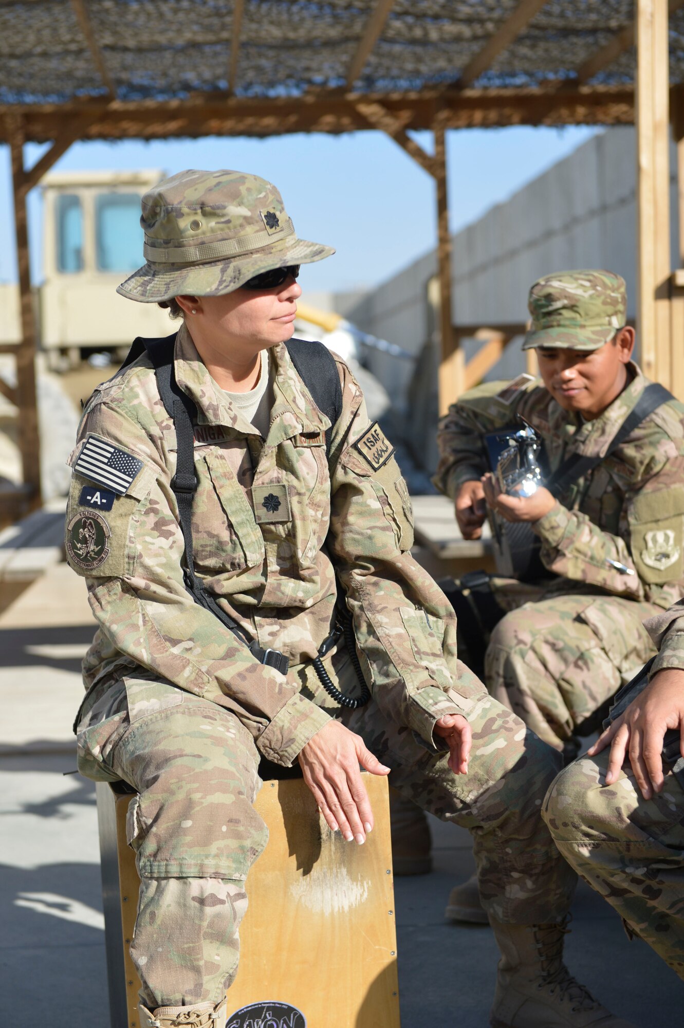 U.S. Air Force Lt. Col. Deborah Zuniga, commander of the 455th Expeditionary Communications Squadron at Bagram Airfield, Afghanistan, plays along with the U.S. Air Force Central Command Band, Hyper Sonic, March 31, 2014. The band spent a day playing short sets at various smaller venues around base, and allowed Service members to join in.(U.S. Air Force photo by Senior Master Sgt. Gary J. Rihn/Released)