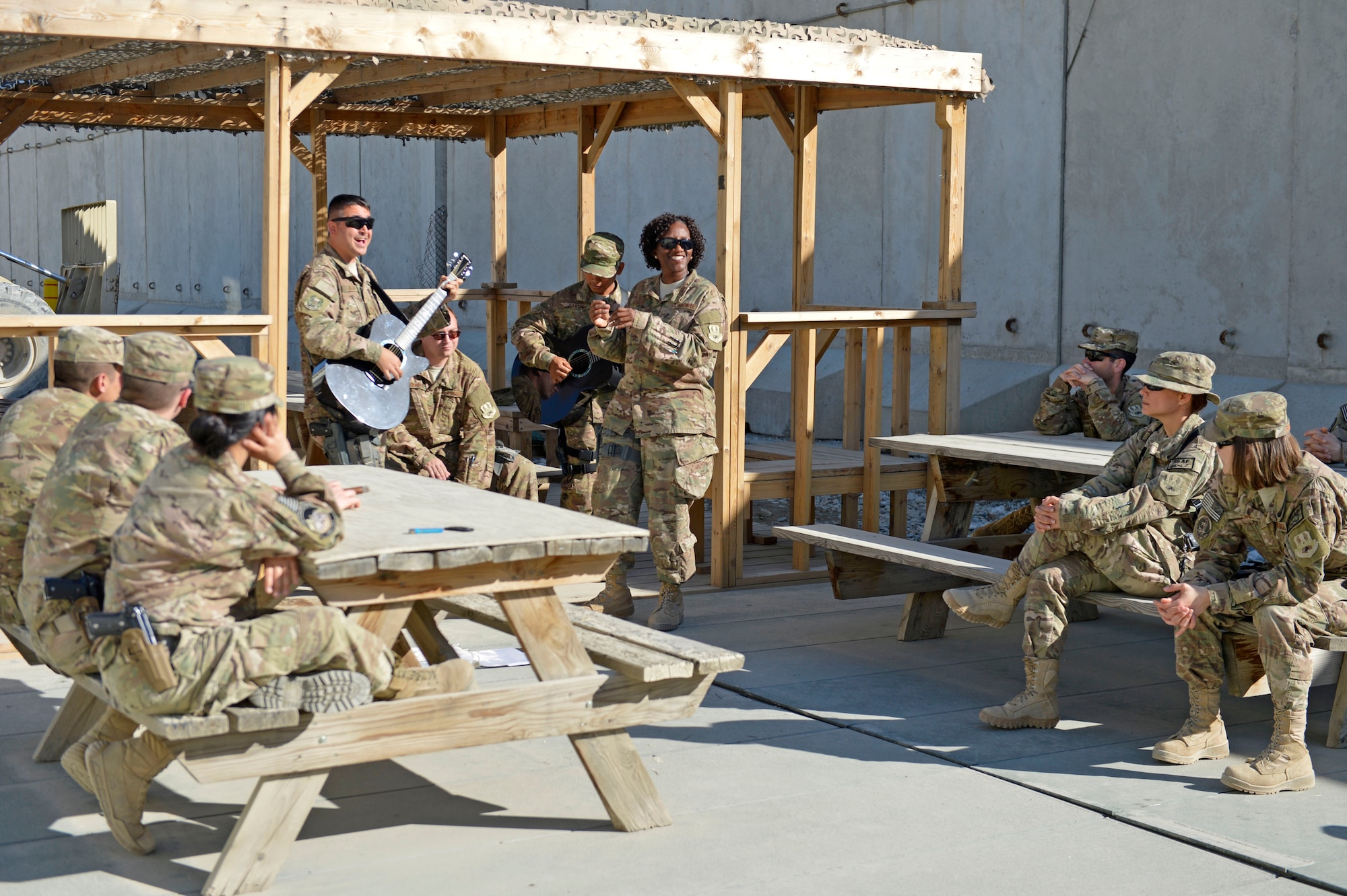 The U.S. Air Force Central Command Band, Hyper Sonic, plays for the 455th Expeditionary Communications Squadron at Bagram Airfield, Afghanistan, March 31, 2014. The band played at various smaller venues around base, entertaining Service members not normally able to attend the larger shows.(U.S. Air Force photo by Senior Master Sgt. Gary J. Rihn/Released)