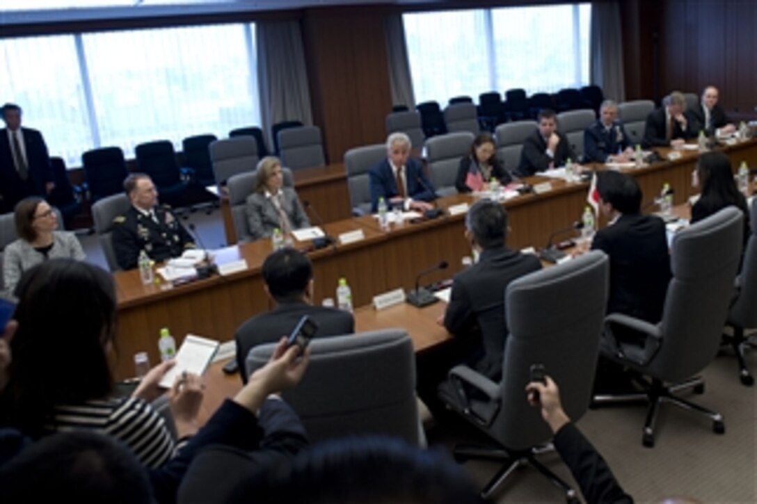 U.S. Defense Secretary Chuck Hagel meets with Japanese Defense Minister Itsunori Onodera as Japanese reporters listen in Tokyo, April 6, 2014. Hagel and Onodera met to discuss issues of mutual importance. 
