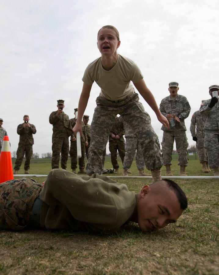 PV2 Victoria Resch, military policewoman, 202nd MP Company, assigned to Black Sea Area Support Team, runs through a mechanical advantage-control holds course after being exposed to oleoresin capsicum spray on Mihail Kogalniceanu Air Base, Romania, April 3, 2014. Marines and soldiers were directly exposed to the OC spray, then instructed to complete a course with stations which required them to execute different take down techniques on a simulated enemy combatant. The Black Sea Area Support team’s mission is to provide base operations support to US Forces in the BSAST Theater of Operations (including Romania and Bulgaria). This includes, but is not limited to, providing life support, logistics support, base camp operations to US forces in the Area of Responsibility (AOR), reception, staging, and onward movement of US forces, fiscal management and budgetary activities, and coordination of force protection of US military and government civilians in the AOR. Black Sea Rotational Force 14 is a contingent of Marines to maintain positive relations with partner nations, regional stability and increase interoperability while providing the capability for rapid contingency response, as directed by U.S. European Command, in the Black Sea, Balkan and Caucasus regions of Eastern Europe. (Official Marine Corps photo by Staff Sgt. Tanner M. Iskra, 2nd Marine Division, Black Sea Rotational Force/ Released).