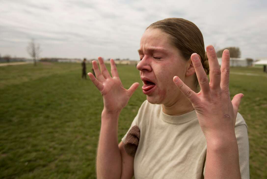 PV2 Victoria Resch, military policewoman, 202nd MP Company, assigned to Black Sea Area Support Team, reacts to the effect of being exposed to oleoresin capsicum spray after running through a mechanical advantage-control holds course on Mihail Kogalniceanu Air Base, Romania, April 3, 2014. Marines and soldiers were directly exposed to the OC spray, then instructed to complete a course with stations which required them to execute different take down techniques on a simulated enemy combatant. Black Sea Area Support Team’s mission is to provide base operations support to US Forces in the BSAST Theater of Operations (including Romania and Bulgaria). This includes, but is not limited to, providing life support, logistics support, base camp operations to US forces in the Area of Responsibility (AOR), reception, staging, and onward movement of US forces, fiscal management and budgetary activities, and coordination of force protection of US military and government civilians in the AOR.  Black Sea Rotational Force 14 is a contingent of Marines to maintain positive relations with partner nations, regional stability and increase interoperability while providing the capability for contingency response, as directed by U.S. European Command, in the Black Sea, Balkan and Caucasus regions of Eastern Europe. (Official Marine Corps photo by Staff Sgt. Tanner M. Iskra, 2nd Marine Division, Black Sea Rotational Force/ Released).