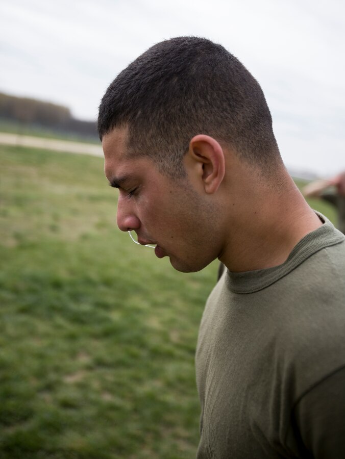 Lance Cpl. Christian Martinez, intelligence specialist, 3rd Battalion, 8th Marine Regiment, 2nd Marine Division assigned to Black Sea Rotational Force 14, reacts to the effect of being exposed to oleoresin capsicum spray after running through a mechanical advantage-control holds course on Mihail Kogalniceanu Air Base, Romania, April 3, 2014. Marines and soldiers were directly exposed to the OC spray, then instructed to complete a course with stations which required them to execute different take down techniques on a simulated enemy combatant. Black Sea Rotational Force 14 is a contingent of Marines to maintain positive relations with partner nations, regional stability and increase interoperability while providing the capability for contingency response, as directed by U.S. European Command, in the Black Sea, Balkan and Caucasus regions of Eastern Europe. (Official Marine Corps photo by Staff Sgt. Tanner M. Iskra, 2nd Marine Division, Black Sea Rotational Force/ Released)
