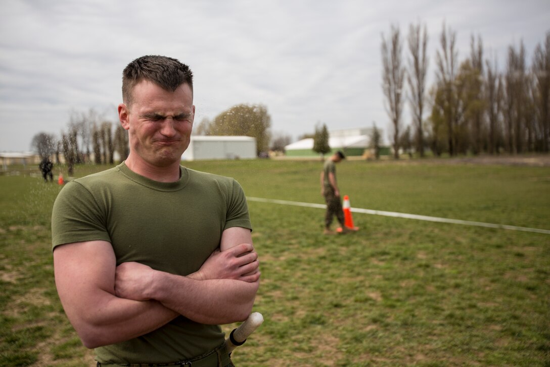 Lance Cpl.  Travis Paskiewicz, chemical, biological, radiological, nuclear defense specialist, assigned to Black Sea Rotational Force, is exposed to oleoresin capsicum spray Mihail Kogalniceanu Air Base, Romania, April 3, 2014. Marines and soldiers were directly exposed to the OC spray, then instructed to complete a course with stations which required them to execute different take down techniques on a simulated enemy combatant. Black Sea Rotational Force 14 is a contingent of Marines to maintain positive relations with partner nations, regional stability and increase interoperability while providing the capability for contingency response, as directed by U.S. European Command, in the Black Sea, Balkan and Caucasus regions of Eastern Europe. (Official Marine Corps photo by Staff Sgt. Tanner M. Iskra, 2nd Marine Division, Black Sea Rotational Force/ Released).