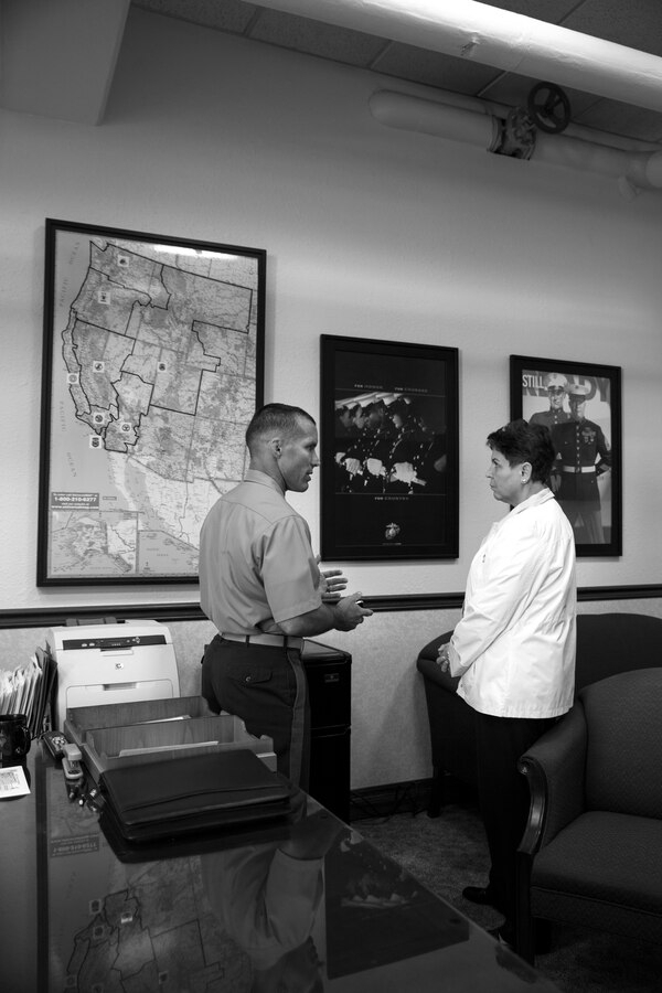 U.S. Marine Corps Lt. Col. Randal Walsh, executive officer, 12th Marine Corp District (MCD), briefs the Honorable Jessica Wright, Under Secretary of Defense for Personnel and Readiness, aboard the Marine Corps Recruit Depot San Diego, April 3, 2014.  Wright was visiting to familiarize herself with the Marines and Recruiting Stations of the 12th MCD. (U.S. Marine Corps Photo by Cpl. Catie Massey/Released)