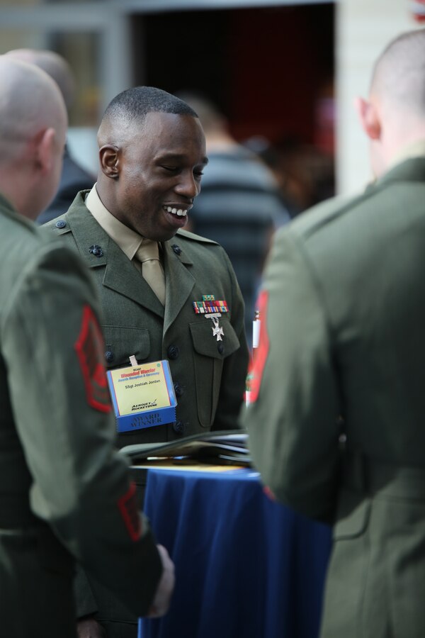Staff Sgt. Joshiah Jordan, recipient of the Wounded Warrior Regiment Leadership Award, talks to a few other Marines during the Wounded Warrior Awards Reception and Ceremony at the National Museum of the Marine Corps on April 3, 2014. Jordan was recognized for his ability to ensure that all the Marines in his charge are given the best opportunities to move forward in their careers and ensuring efficiency in the work place. 