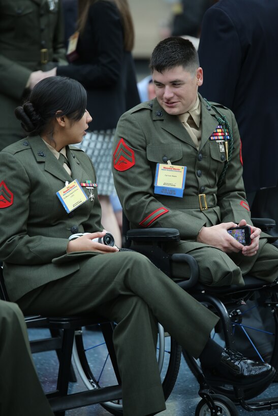 Cpl. Ivan Sears, recipient of the Wounded Warrior Wounded, Ill or Injured Service Member Award, talks to a fellow Marine during the Wounded Warrior Awards Reception and Ceremony at the National Museum of the Marine Corps on April 3, 2014. Sears was recognized for his optimism and for his actions as an athlete representing the Wounded Warrior Regiment and the Marine Corps during several sporting events. 
