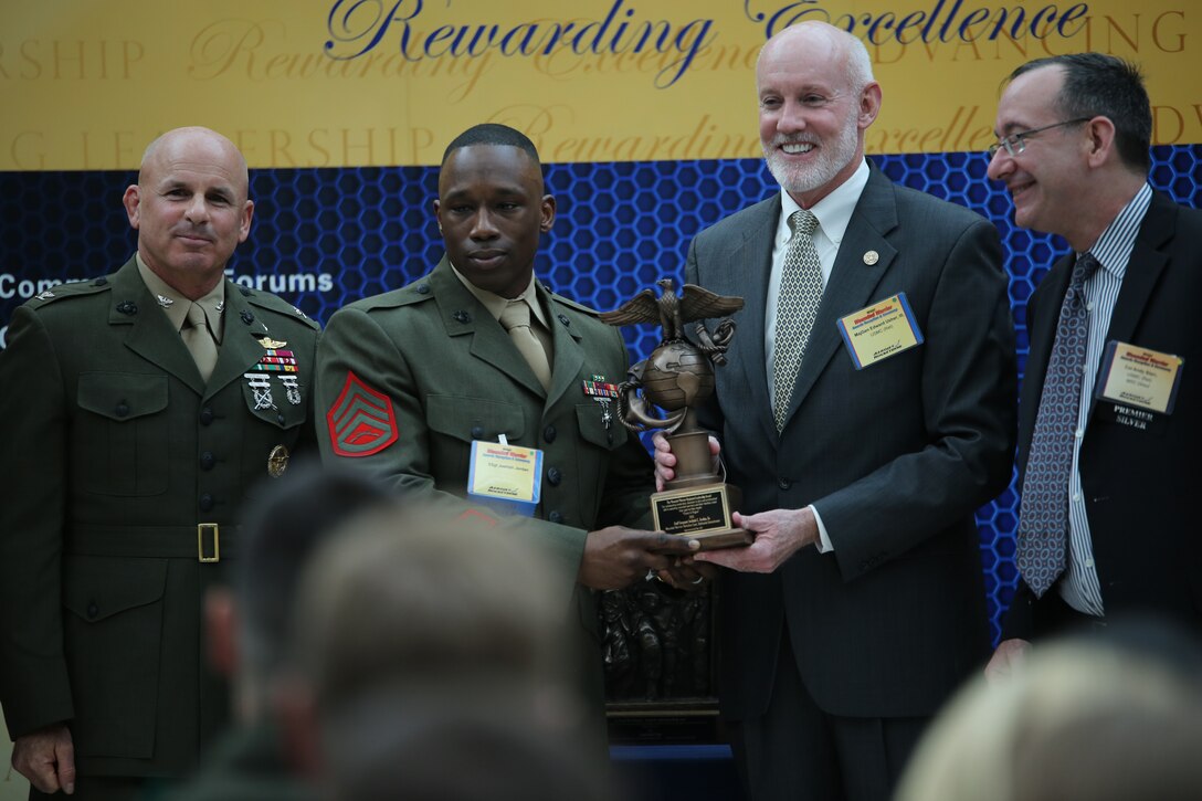 Staff Sgt. Joshiah Jordan, a platoon commander with Company C, Wounded Warrior Bn. East, Bethesda Detachment, receives the Wounded Warrior Regiment Leadership Award during the Wounded Warrior Awards Reception and Ceremony at the National Museum of the Marine Corps on April 3, 2014. Jordan was selected for his outstanding performance as a platoon commander and a unanimous nomination by the members of his detachment. 