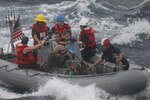 Sailors from Oliver Hazard Perry-class frigate USS Vandegrift (FFG 49) assist in the rescue of the Kaufman family with a sick infant via the ship's small boat as part of a joint U.S. Navy, Coast Guard and California Air National Guard rescue effort. The family and four Air National Guard pararescuemen were safely moved from the sailboat to the Vandegrift, and the ship is now sailing to San Diego.