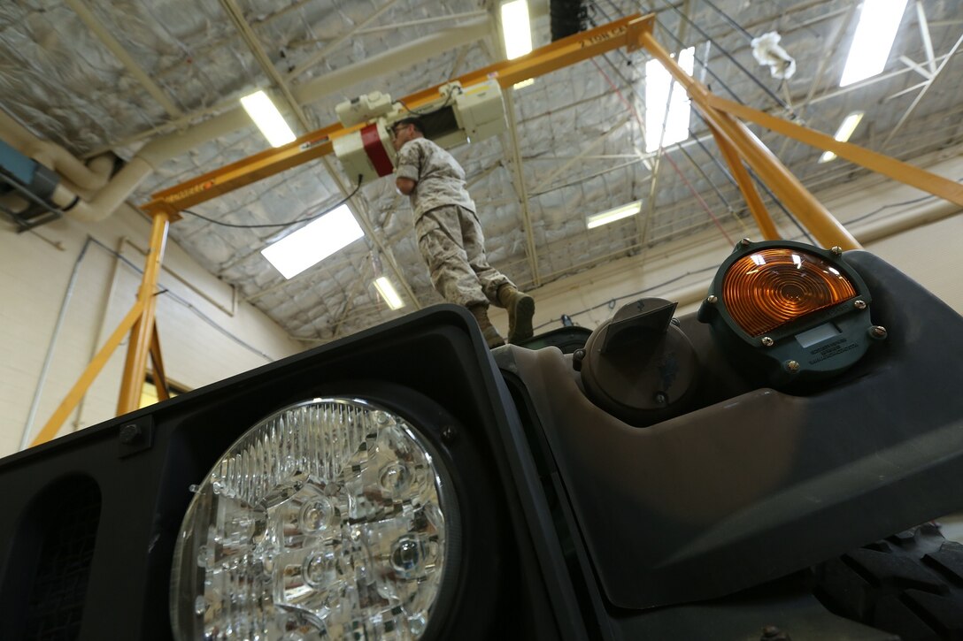 A Marine with Combat Service Support Company, I Marine Expeditionary Force Headquarters Group, readies to rig a lift aboard Camp Pendleton, Calif., April 3, 2014. The Marines raised the readiness percentage by 20 percent over a month.




