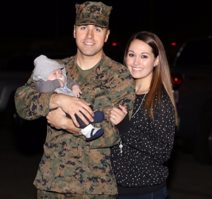 Cpl. Nicholas Mastorakos, left, an aviation ordnanceman with Marine Fighter Attack Squadron (VMFA) 323, and his wife, Jessica Mastorakos, right, stand for a picture upon his return from deployment. During Cpl. Mastorakos’ deployment, Jessica gave birth to their first-born son, one of the many hardships they’ve faced as a military couple. Through all of the hardships, Jessica remains positive and works to help others do the same.
