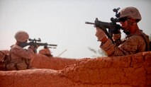Lance Cpl. Andres Rodriguez uses his scope to locate a sniper who was firing on his platoon's position during an early morning patrol near Patrol Base Boldak July 31, 2013. Rodriguez is an infantryman with 1st Platoon, Fox Company, 2nd Battalion, 2nd Marine Regiment.(Photo By: Sgt. Bobby J. Yarbrough)