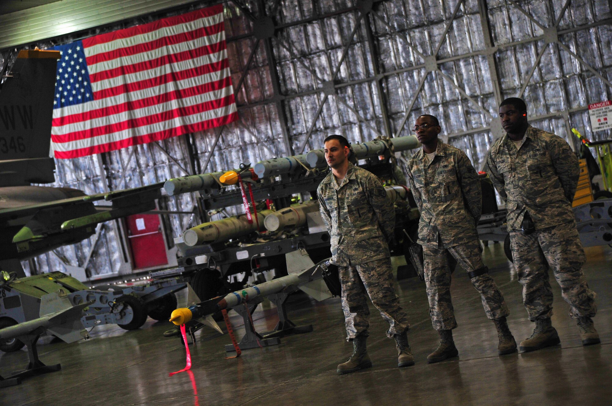 The 14th Aircraft Maintenance Unit team awaits the start of the Weapons Load Crew of the Quarter Competition at Misawa Air Base, Japan, April 4, 2014. The quarterly competition pins the best load crew team from the 13 AMU and 14 AMU. (U.S. Air Force photo/Senior Airman Jose L. Hernandez-Domitilo)