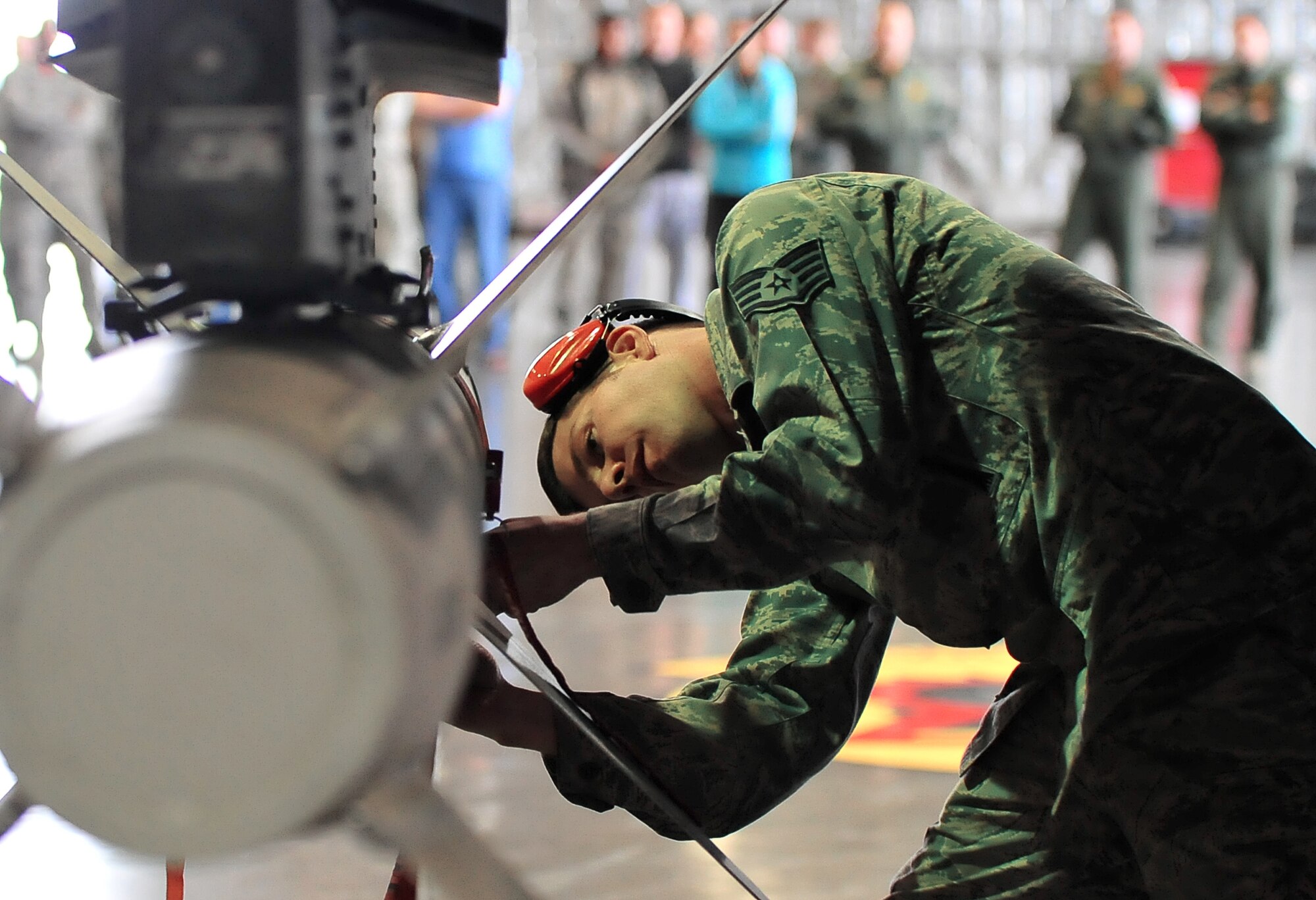U.S. Air Force Staff Sgt. Nathaniel Monica, 13th Aircraft Maintenance Unit weapons load crew chief, conducts an operations check on an AGM-88 High-speed Anti-Radiation Missile as part of a weapons load crew competition at Misawa Air Base, Japan, April, 4, 2014. During the Weapons Load Crew of the Quarter Competition members are evaluated on performance at every turn. (U.S. Air Force photo/Senior Airman Jose L. Hernandez-Domitilo)