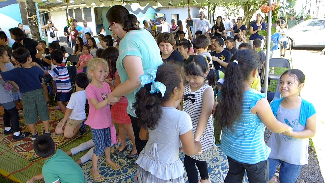 PAGO PAGO, American Samoa-- The students of the Pacific Horizons School get up and dance for an energetic performance from Small Kine on March 27, 2014. (US Air Force Photo/ TSgt Michael Smith/ Released)