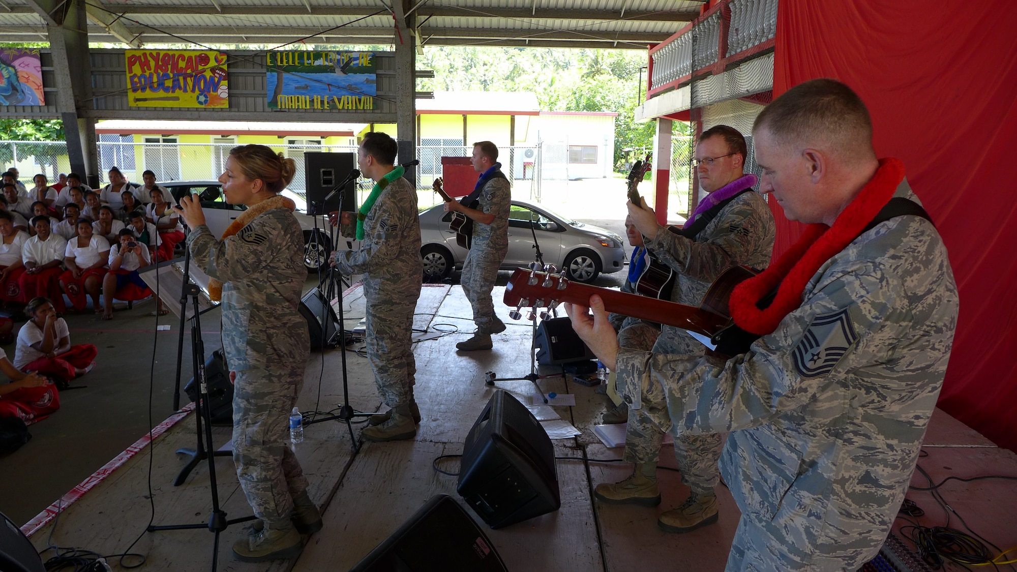 FAGA'ITUA, American Samoa-- The members of Small Kine, lead by NCOIC SMSgt Gary Noel (far right), performs for a very enthusiastic audience of students at Faga'itua High School, Mar. 25, 2014. The group went to American Samoa to perform for the local community. (US Air Force Photo/ TSgt Michael Smith/ Released)
