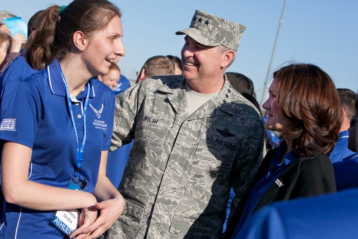 Air Force Chief of Staff Gen. Mark A. Welsh III and his wife, Mrs. Betty Welsh, speak with Ramina Oraha, an Air Force Wounded Warrior participant April 7, 2014, at Nellis Air Force Base, Nev. The Air Force Wounded Warrior Trials will feature seven events to include archery, basketball, cycling, track and field, swimming, shooting and volleyball. (U.S. Air Force Photo by Lorenz Crespo)