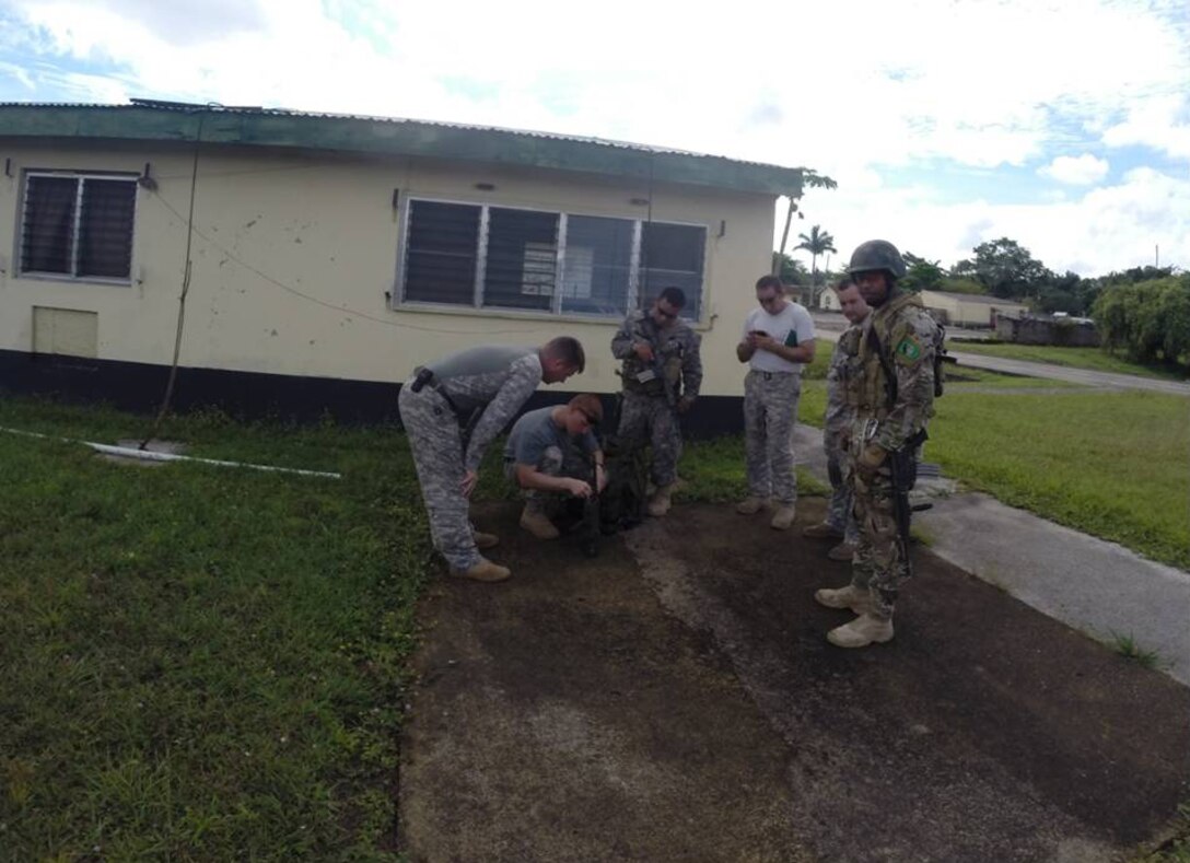 Members of Joint Task Force Bravo and the Belizean forces prepare to search for marijuana fields in Belize March 15-20, 2014.  The operation resulted in the Belizean government destroying 34 marijuana fields and approximately 57,283 mature marijuana plants for an initial estimated value of  $29 million.  In addition, the team also found and destroyed 25 pounds of marijuana seeds.  Joint Task Force-Bravo provided aviation support, on-call casualty evacuation and caving ladder training for 52 Belizean personnel who participated in the operation.  (Courtesy photo)