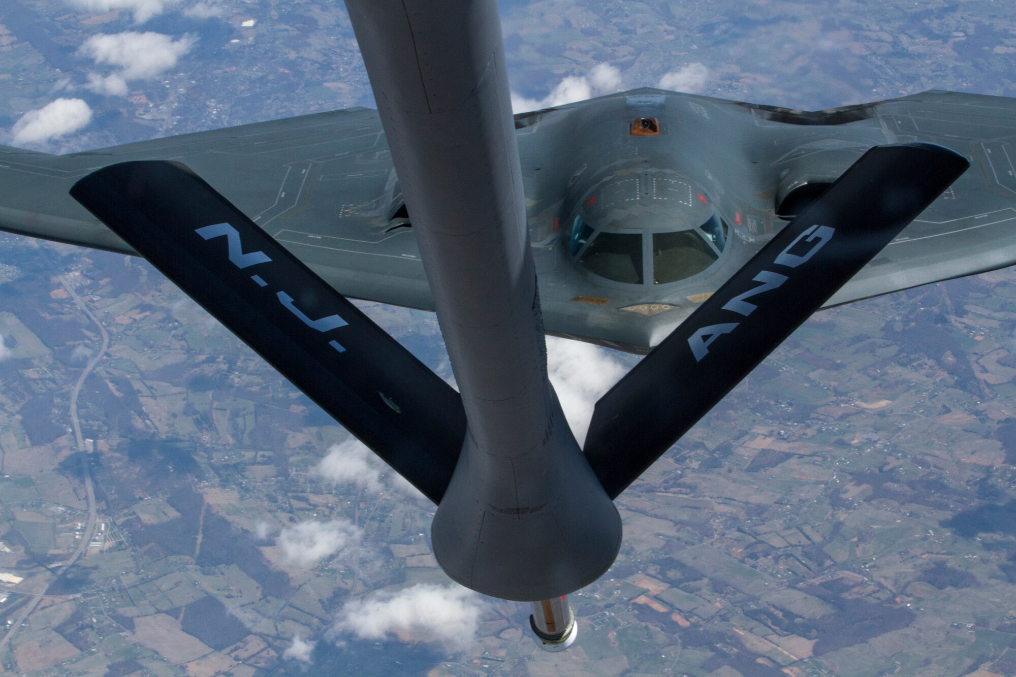A 108th Wing KC-135 Stratotanker with the New Jersey Air National Guard, assigned to Joint Base McGuire Dix-Lakehurst, N.J., refuels a B-2 Spirit bomber April 2, 2014. The air refueling mission provided 25 Air Force ROTC cadets from Detachment 750, St. Joseph's University, Philadelphia, Pa., the opportunity to observe the mission as part of the 108th Wing's orientation flight program. The orientation flight offers the cadets an opportunity to observe the pilots and aircrew perform their jobs in a real world environment. The B-2 Spirit, which is part of Air Force Global Strike Command is a multi-role bomber capable of delivering both conventional and nuclear munitions, is stationed at Whiteman Air Force Base, Mo. (U.S. Air National Guard photo by Master Sgt. Mark C. Olsen/Released)