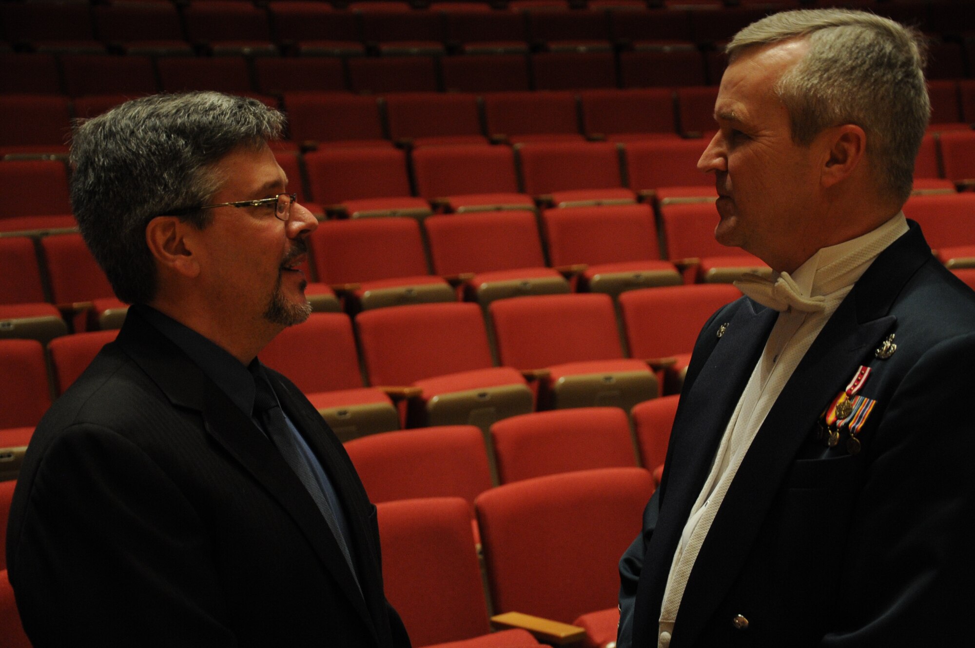 Robert Sullivan and Col. Larry Lang discuss music after a performance by the U.S. Air Force Band at Northwestern University in Evanston, Ill., April 6, 2014. Lang asked Sullivan, a former Air Force bandsman, to be a guest performer during the show. Sullivan is the professor of trumpet at Northwestern University. Lang is the commander and conductor of the Band. (U.S. Air Force photo/Master Sgt. Tammie Moore)