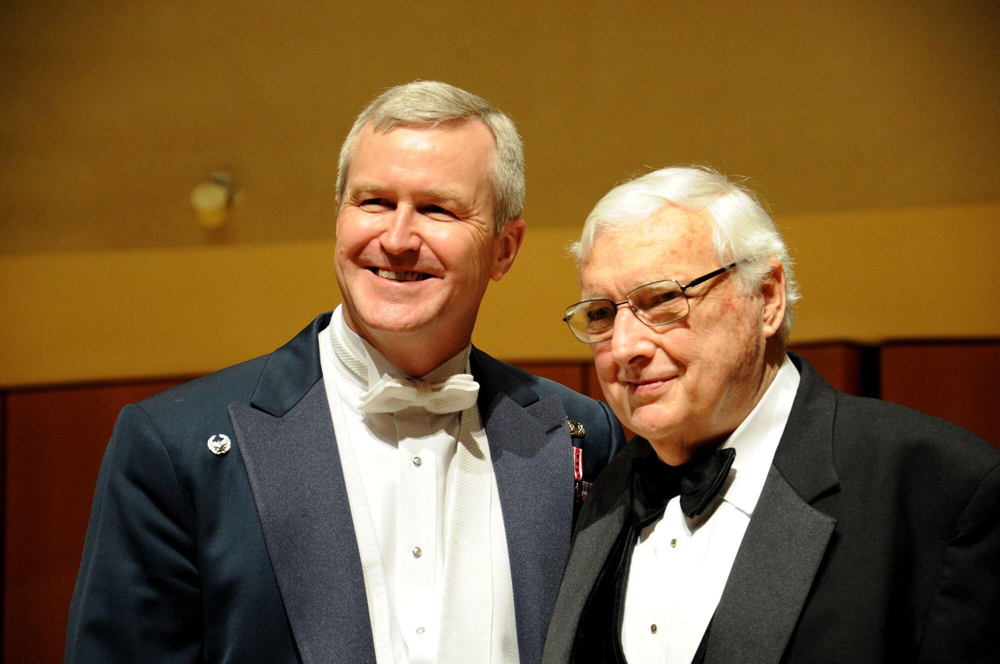 Col. Larry Lang and Dick Shorey pose for a photo after a performance by the U.S. Air Force Band at Northwestern University in Evanston, Ill., April 6, 2014. Lang asked Shorey, a former Air Force bandsman, to be a guest conductor during the show. Shorey served during the Korean War. Lang is the commander and conductor of the Band. (U.S. Air Force photo/Master Sgt. Tammie Moore)