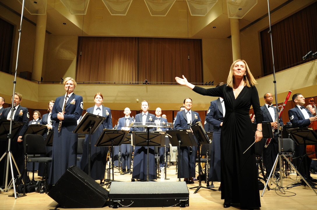 Dr. Mallory Thompson receives applause after conducting a performance by the U.S. Air Force Band at Northwestern University in Evanston, Ill., April 6, 2014. Thompson is Northwestern University’s director of bands. (U.S. Air Force photo/Master Sgt. Tammie Moore)