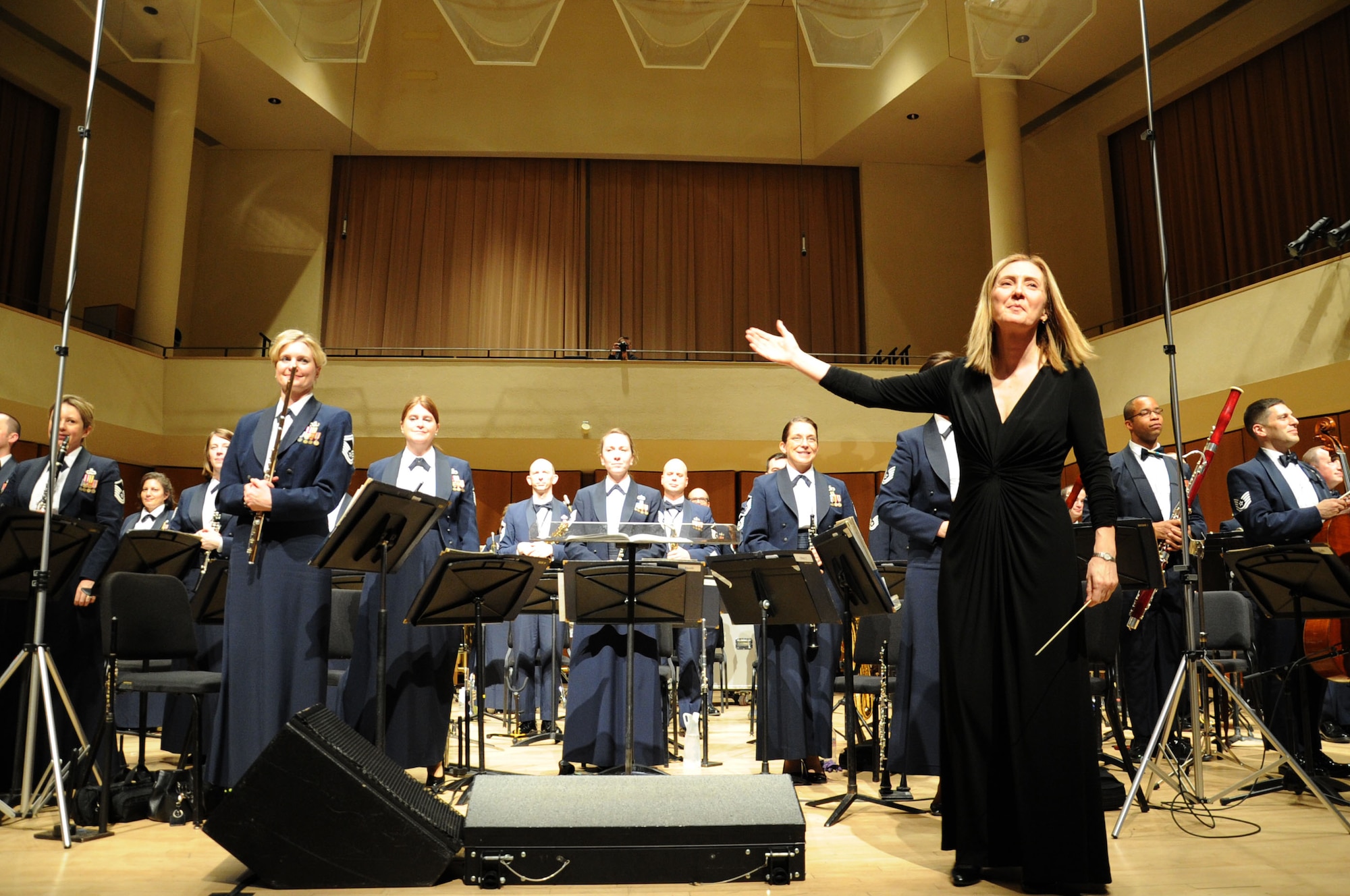 Dr. Mallory Thompson receives applause after conducting a performance by the U.S. Air Force Band at Northwestern University in Evanston, Ill., April 6, 2014. Thompson is Northwestern University’s director of bands. (U.S. Air Force photo/Master Sgt. Tammie Moore)